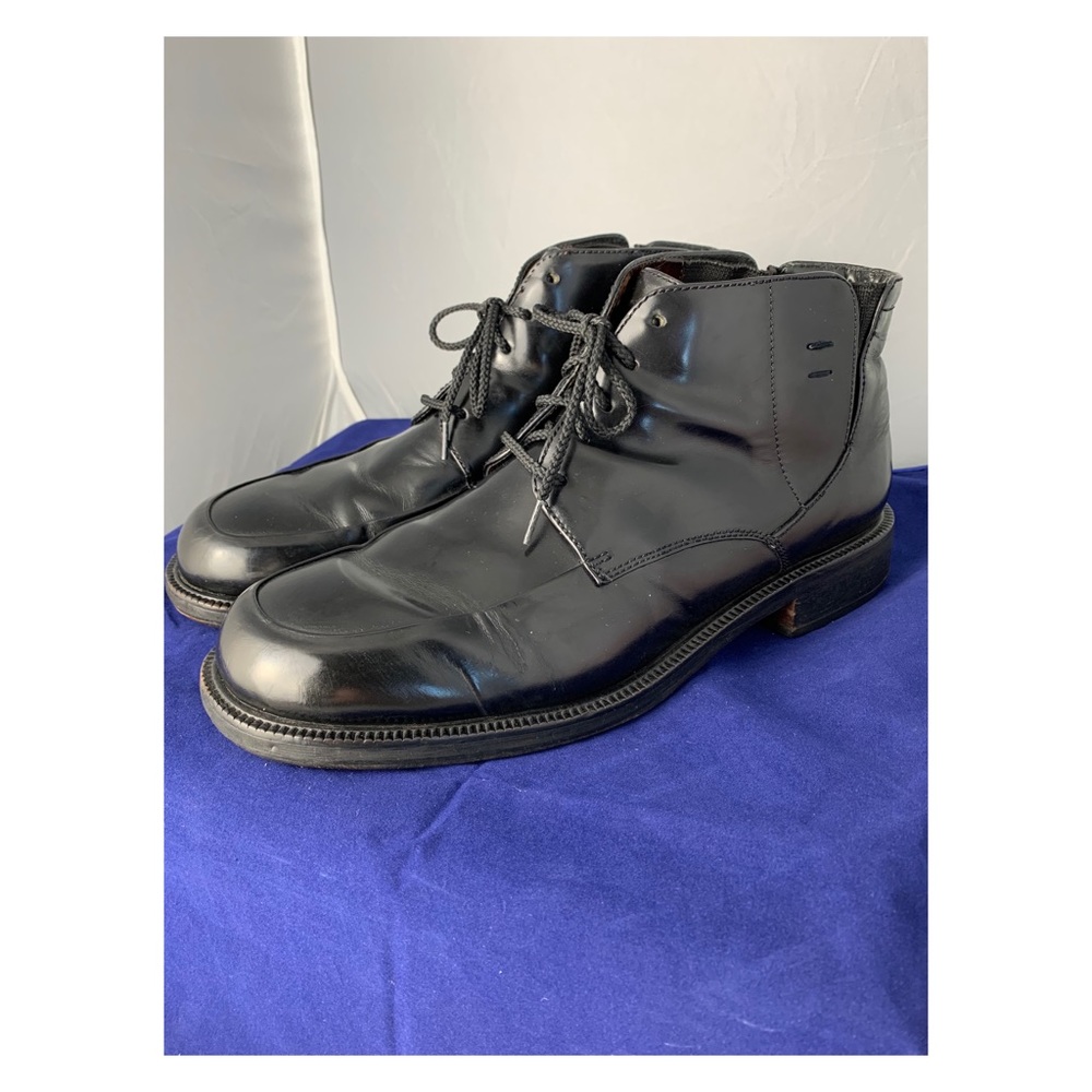 Cole Haan 
Black leather lace up boots